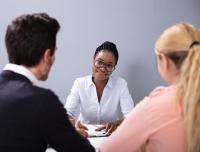 couple talking with adoption agency