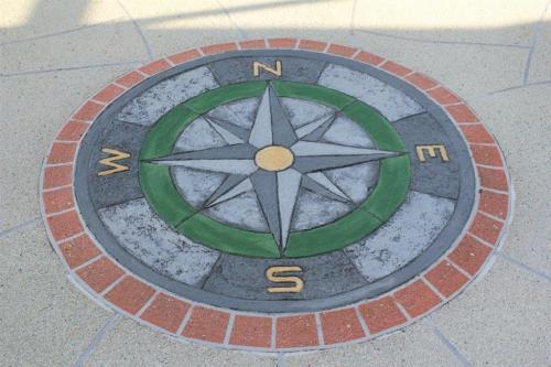 Concrete overlay with compass design