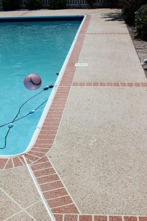 Decorative Concrete pool deck with brick border