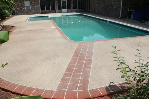 Decorative Concrete pool deck with tile pattern border