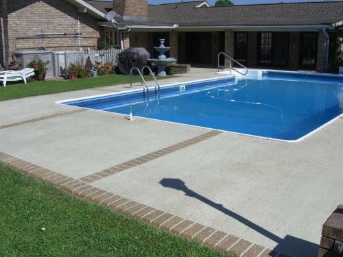 Concrete overlay with brick border