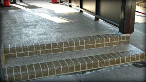 Concrete overlay with brick border