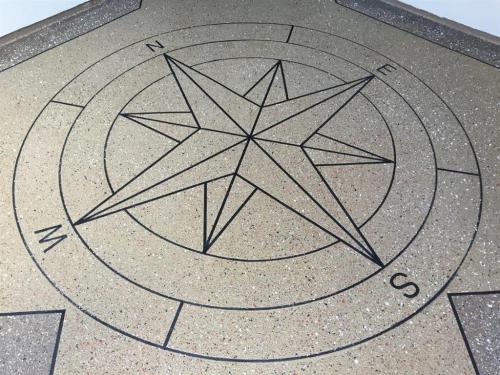 Concrete overlay with compass
