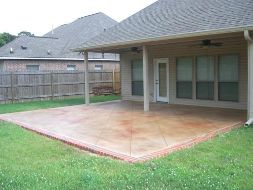 Diamond tile pattern concrete overlay with brick border
