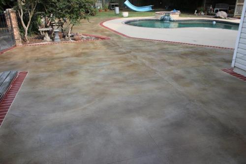 Concrete overlay with brick border