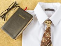 reading glasses, BIble, and white shirt with tie
