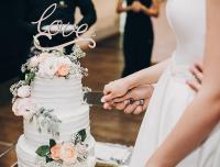 bride and groom cutting a wedding cake