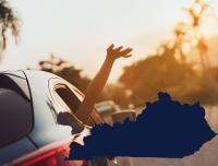 hand raised out of car window and state outline for Kentucky