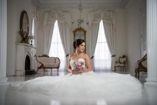 Woman posing for wedding portrait in wedding dress