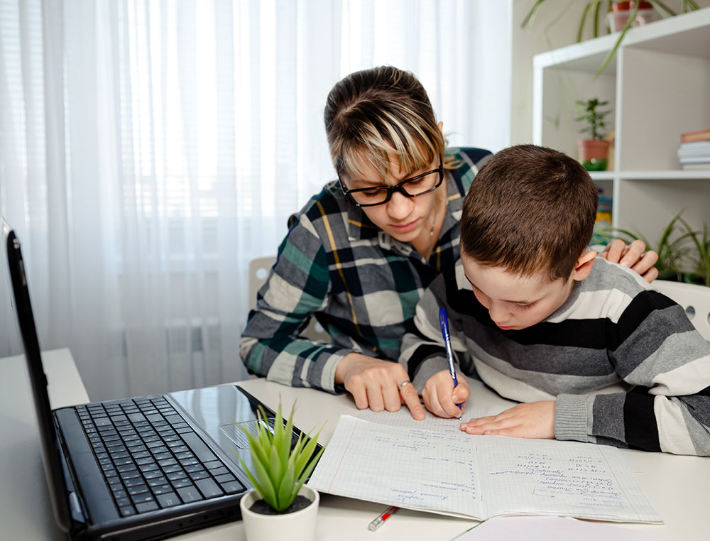 Mom homeschooler her son