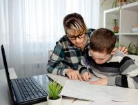 Mom homeschooler her son