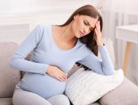 distressed young pregnant woman