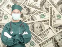 doctor in scrubs and mask with 100 bills in the background