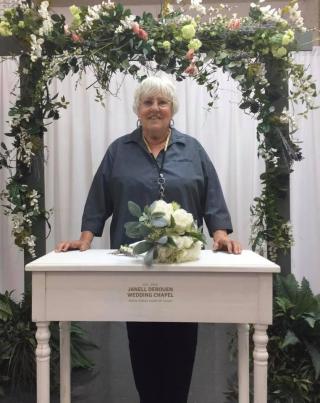 Janell Derouen standing at the alter in the wedding chapel
