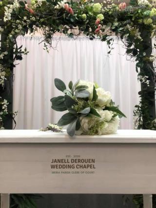 Janell Derouen wedding chapel alter with flowers on top