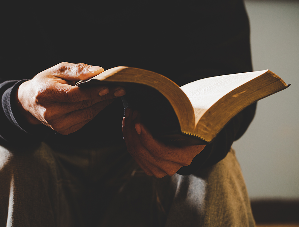 man reading bible