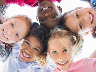 kids smiling after visiting Anderson Dental's pediatric dentist