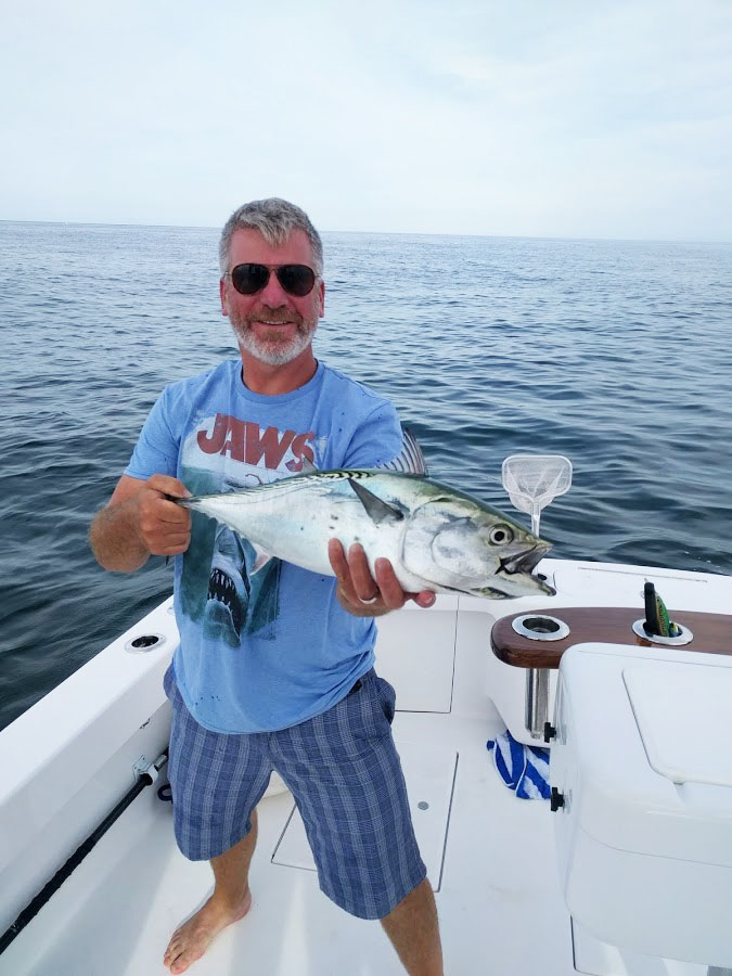 "Excuse" L&H 33' Walkaround. Angler with His Catch
