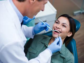 Woman smiling at dentist | botox and dental bridges in Baton Rouge 70809