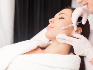 woman smiling getting botox from our cosmetic dentist in Baton Rouge 70809