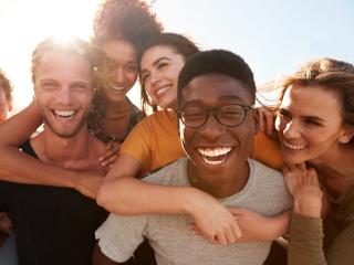 Friends smiling outside after getting restorative and cosmetic dental care from our dentist in Baton Rouge 70809