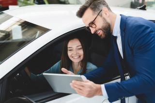 Woman in car talking to a man
