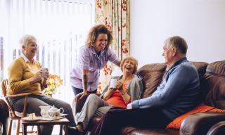 Caregiver with happy family 