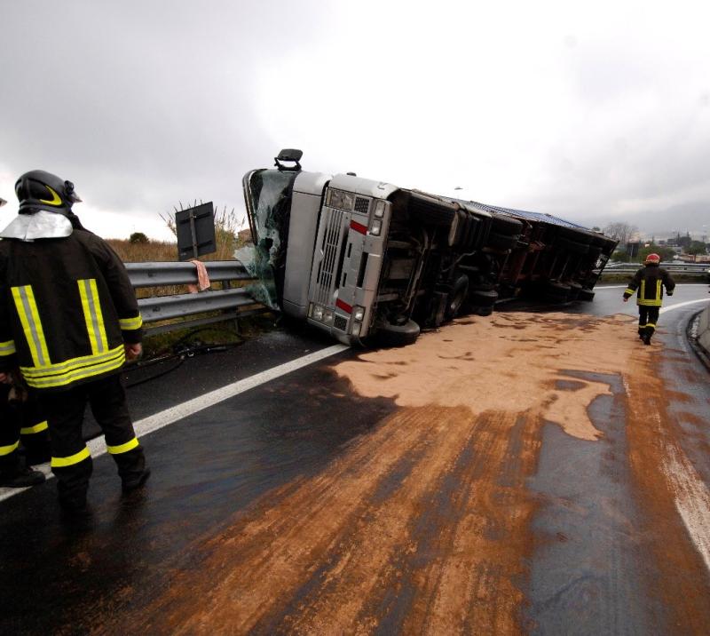 crashed truck with two men checking on it