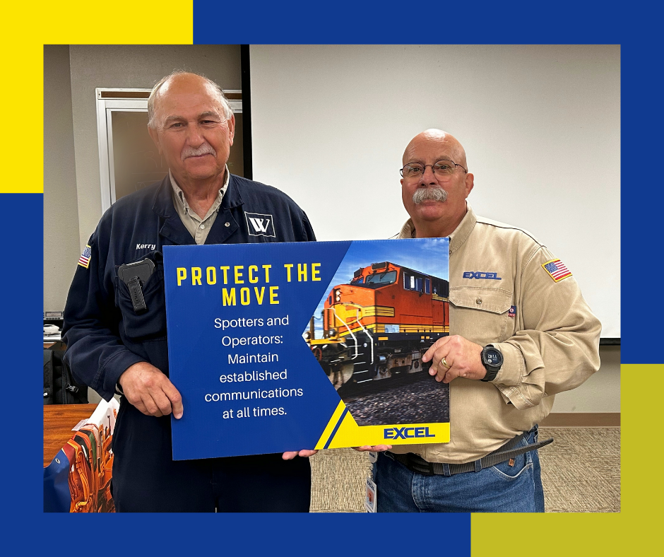 Kerry Cook and Richard Beemer Hold Protect The Move Sign