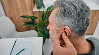 An Old Man at Clinic Showcasing Hearing Treatment in Florida