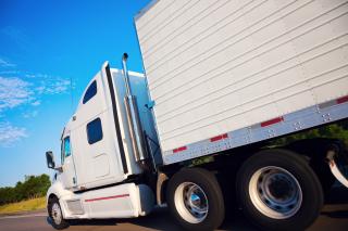 Semi truck with trailer on the road