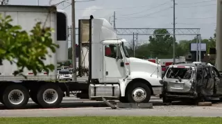 Semi Truck in a rear end crash with a car