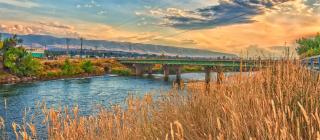 a river in Wyoming with a bridge