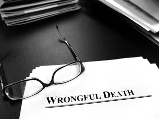 Wrongful death claim papers on a desk