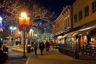 A couple walking in Fort Collins Old Town