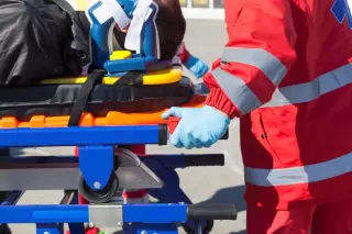 first responders help rollover accident victim