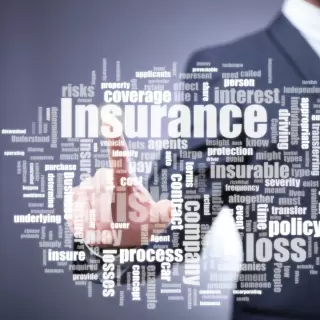 Man pointing the the word insurance and related terms