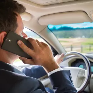 Man Driving While Talking On Phone