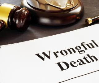 Wrongful death claim papers on a desk