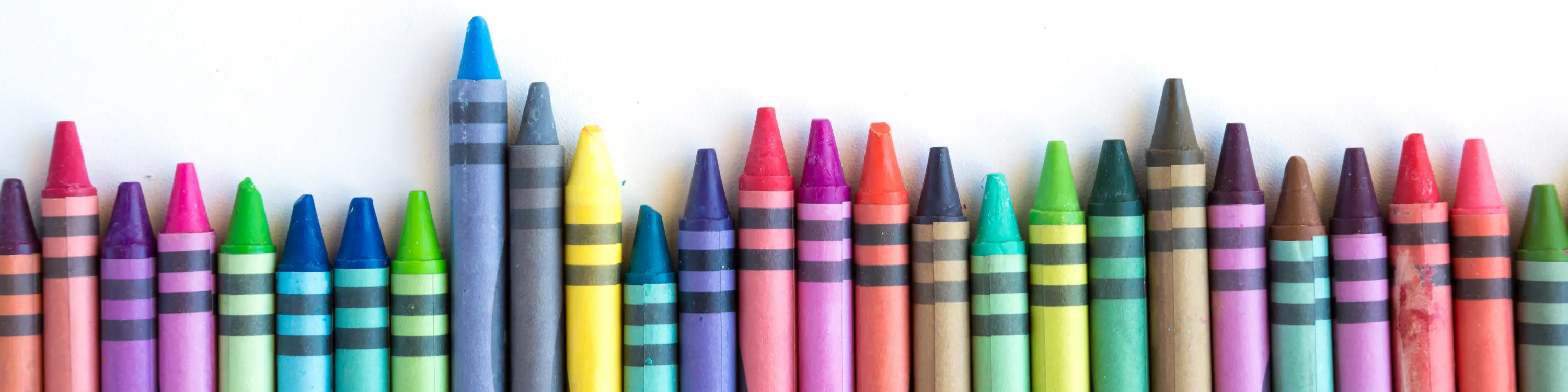 Single row of staggered crayons of various colors.