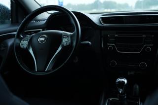 Interior of a Nissan Car showing steering wheel