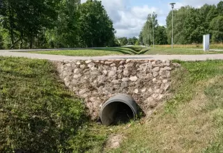 Gulf Coast lot roadside ditch with culvert installed for new driveway access