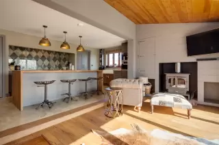 Kitchen layout with large island seating and open workflow in a Gulf Coast custom home
