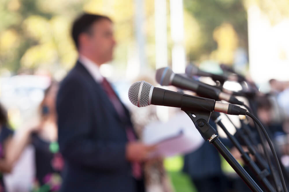 the press and series of microphones