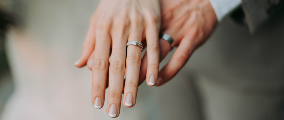 shot of the hands of a married man and married woman