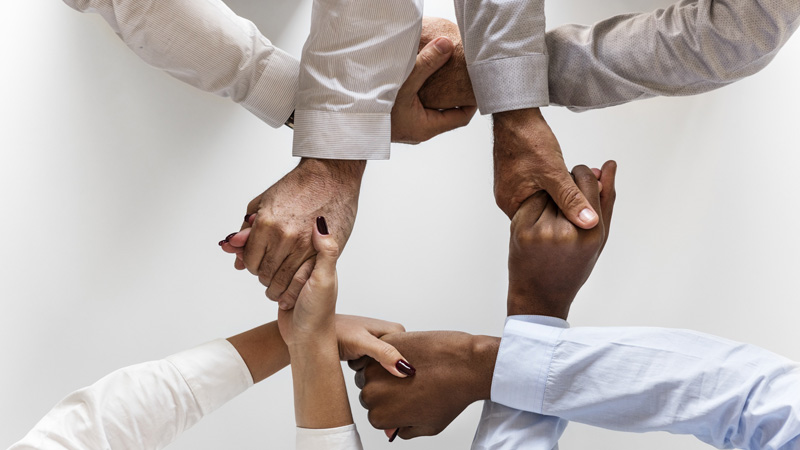 clasped hands in a circle