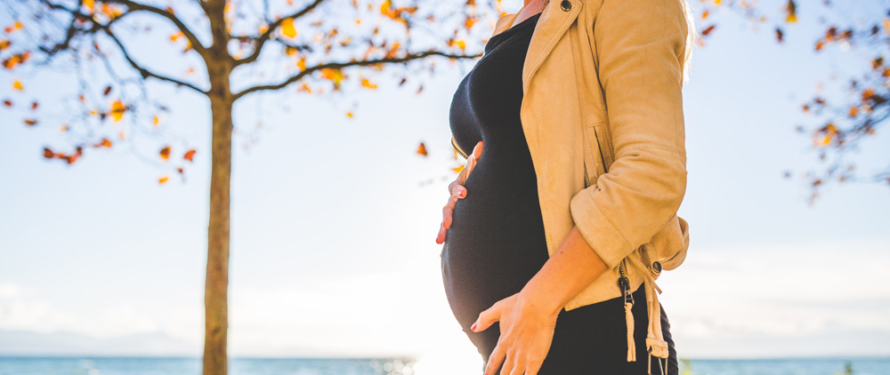 pregnant woman in autumn