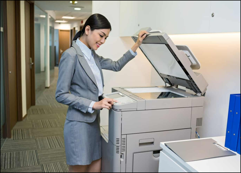 person at copy machine