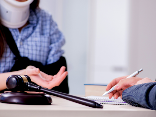 Injured Woman Signing Document After Auto Accident