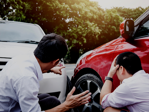 Two men discuss the aftermath of a car accident